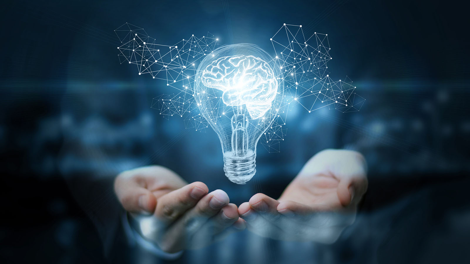 Hands under lightbulb with brain symbolising ideas and insight